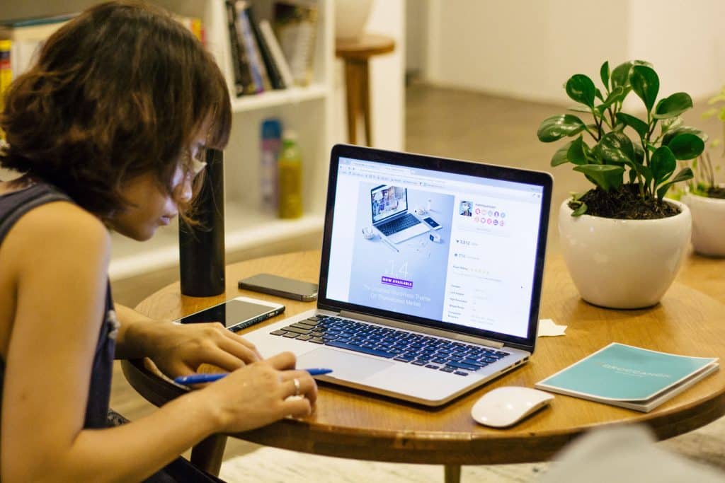 Female worker at home using laptop